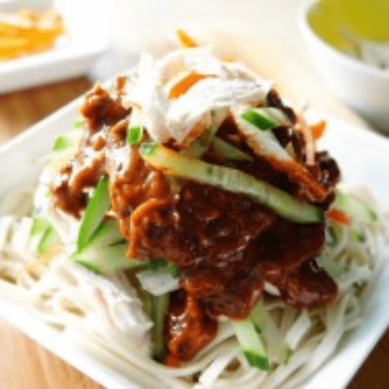 Thai Noodles with red hot chill and vegetables served on a plate