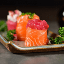 Rolls of raw fish like sushi with vegetables